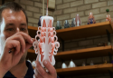 Hand-carving candles in The Candle Studio